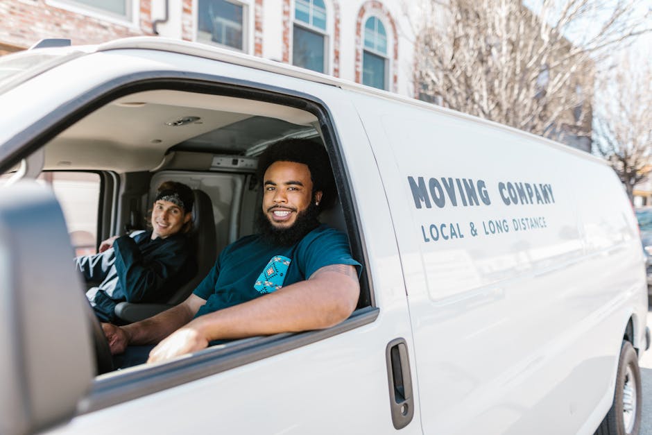 Team of smiling professional movers ready to assist
