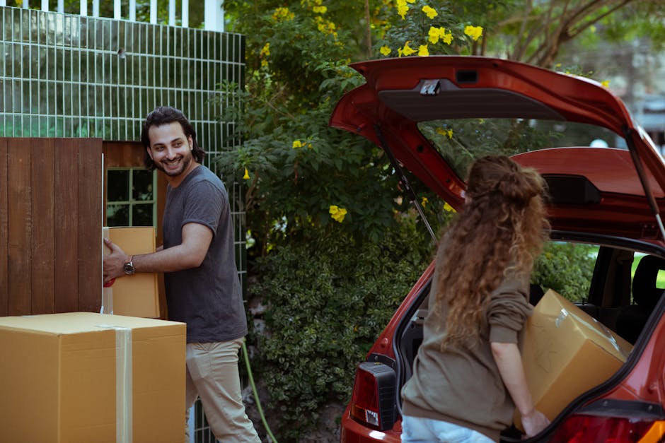 Movers unloading boxes into a new residential home