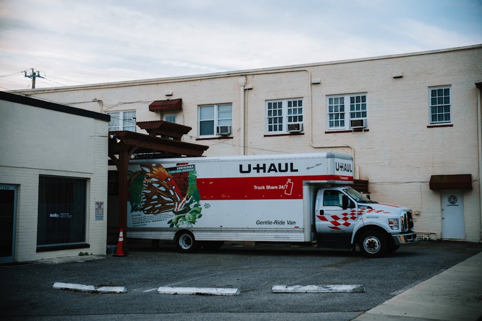 Moving truck parked securely outside a residential home